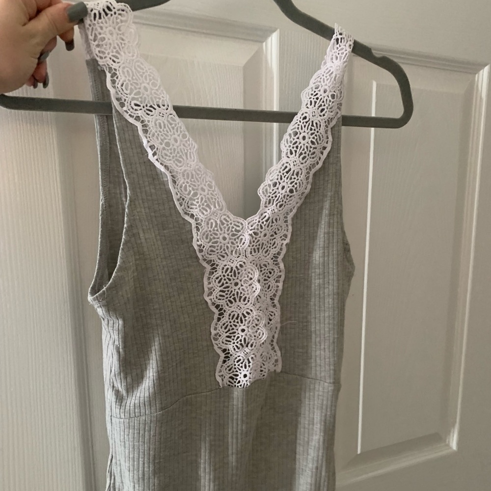 Never worn, great condition just didn’t fit. Grey and white body suit with lace.